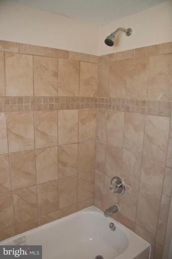 1303 Crofton Road Baltimore, MD 21239 - Photo 13 of 17 a bathroom with a bathtub