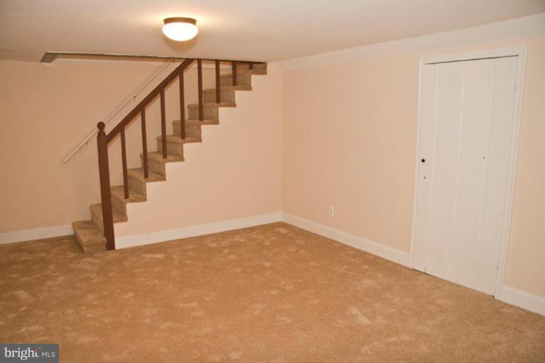 1303 Crofton Road Baltimore, MD 21239 - Photo 9 of 17 a view of an entryway with staircase