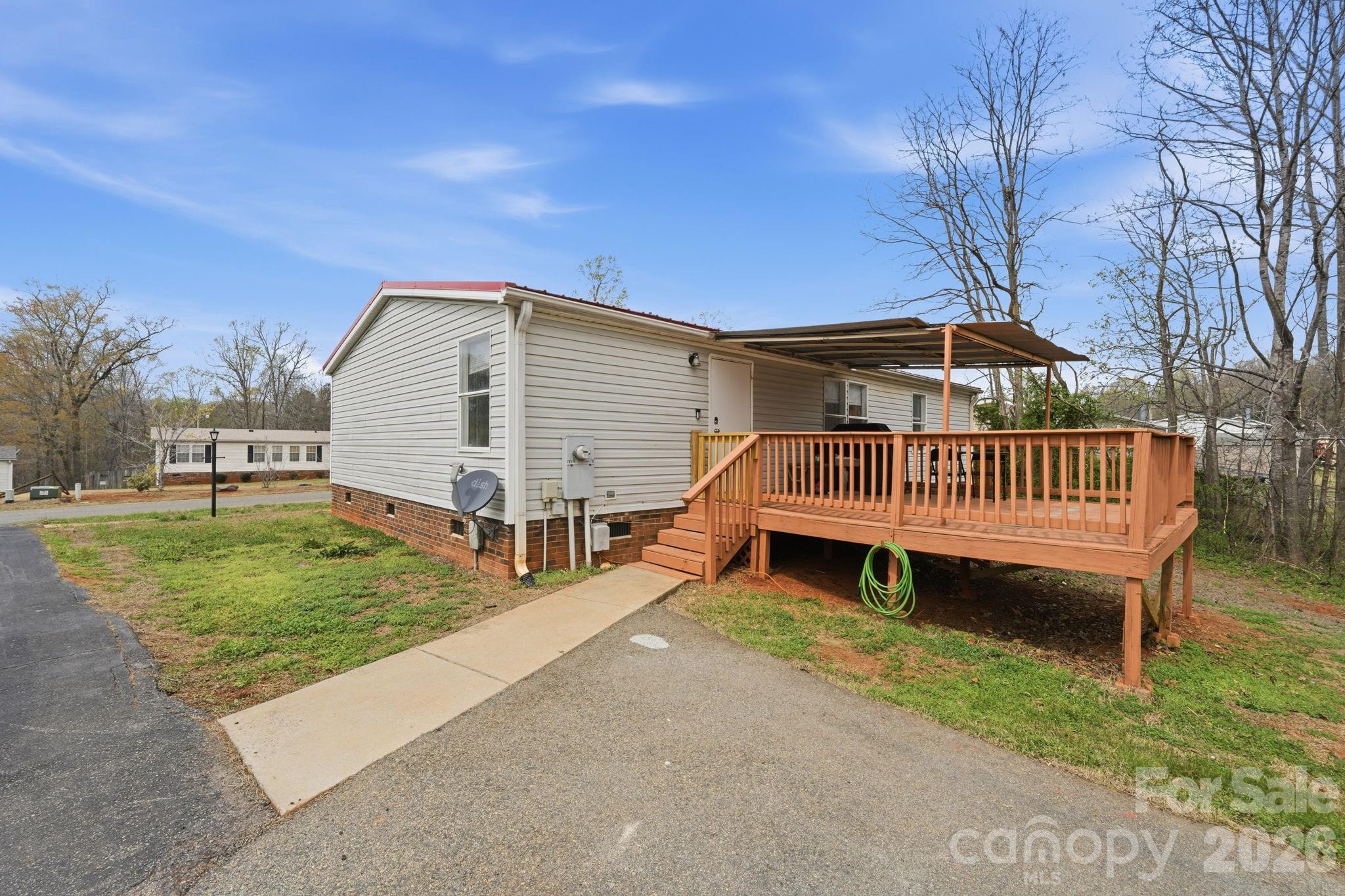 2862 Eagle Point Drive Trinity, NC 27370 - Photo 26 of 31 a view of a house with a yard and deck