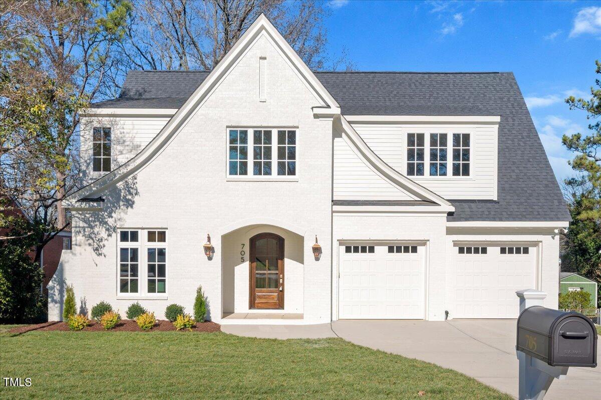 705 Mills Street Raleigh, NC 27608 - Photo 1 of 23 a front view of a house with a yard