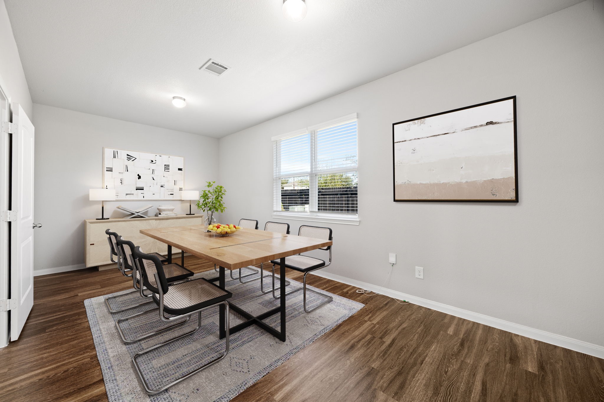 18606 Lansdowne Stream Path Katy, TX 77449 - Photo 7 of 39 a view of a dining room with furniture and wooden floor