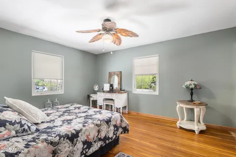 a bedroom with a bed and a table in it