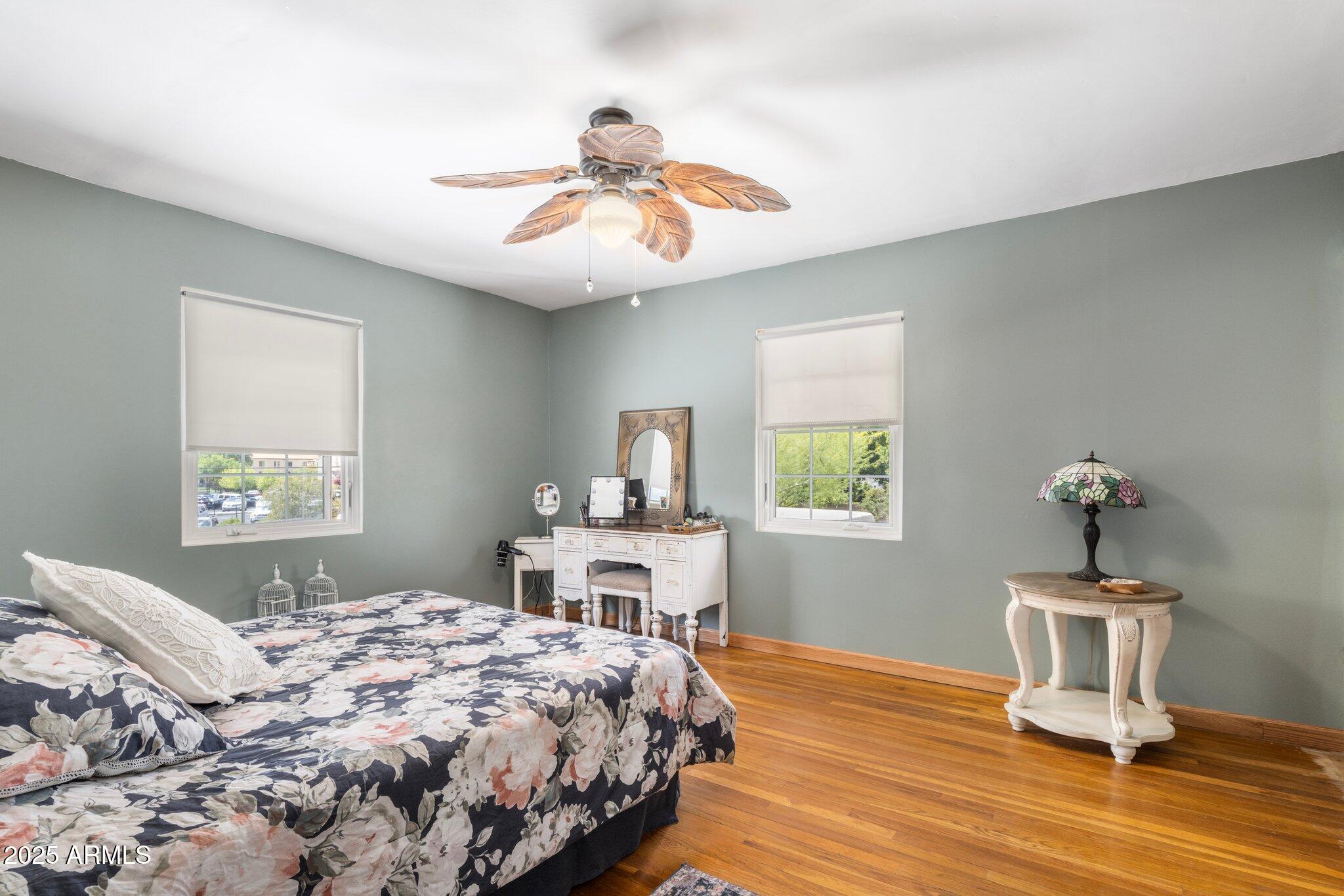 55 East Pierson Street Phoenix, AZ 85012 - Photo 18 of 26 a bedroom with a bed and a table in it