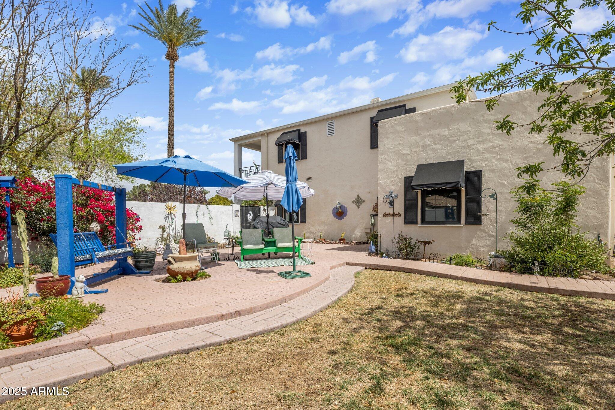 55 East Pierson Street Phoenix, AZ 85012 - Photo 20 of 26 a view of a house with a yard and sitting area