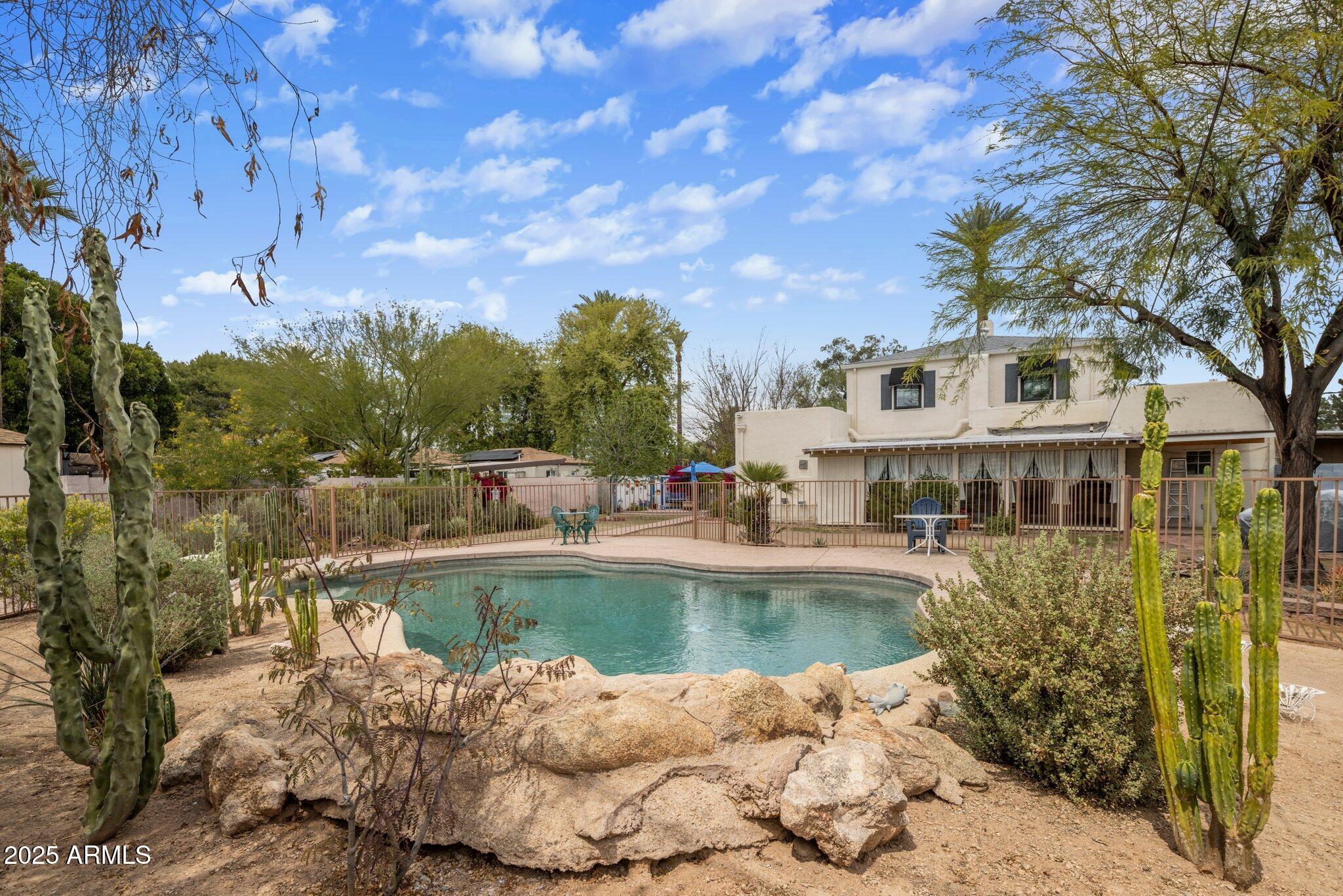 55 East Pierson Street Phoenix, AZ 85012 - Photo 21 of 26 a view of a swimming pool with a patio
