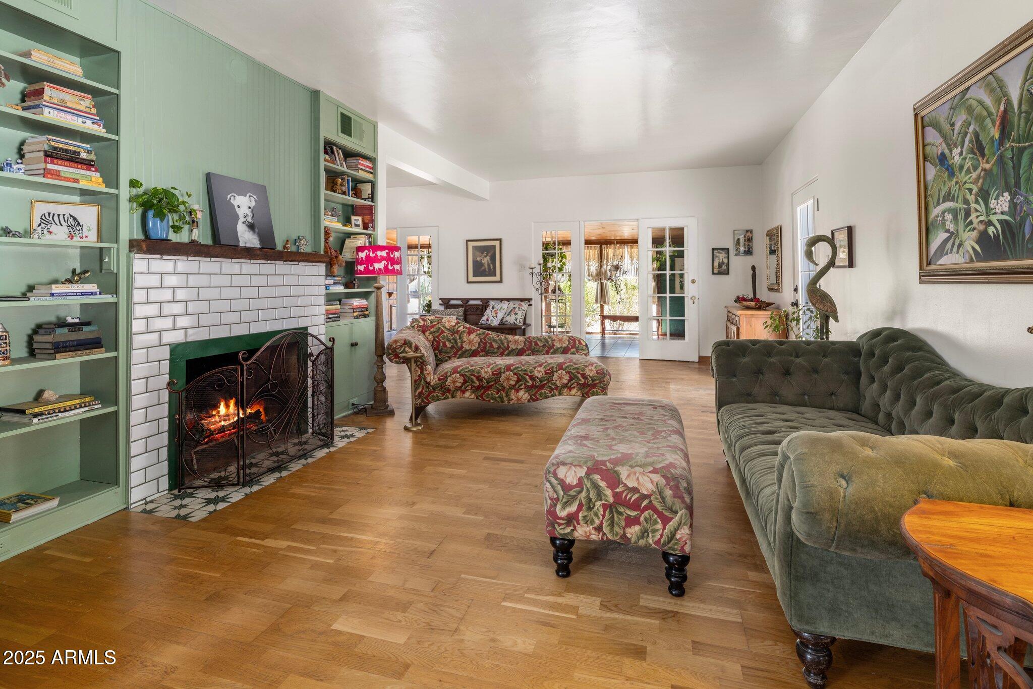 55 East Pierson Street Phoenix, AZ 85012 - Photo 2 of 26 a living room with furniture a flat screen tv and a fireplace