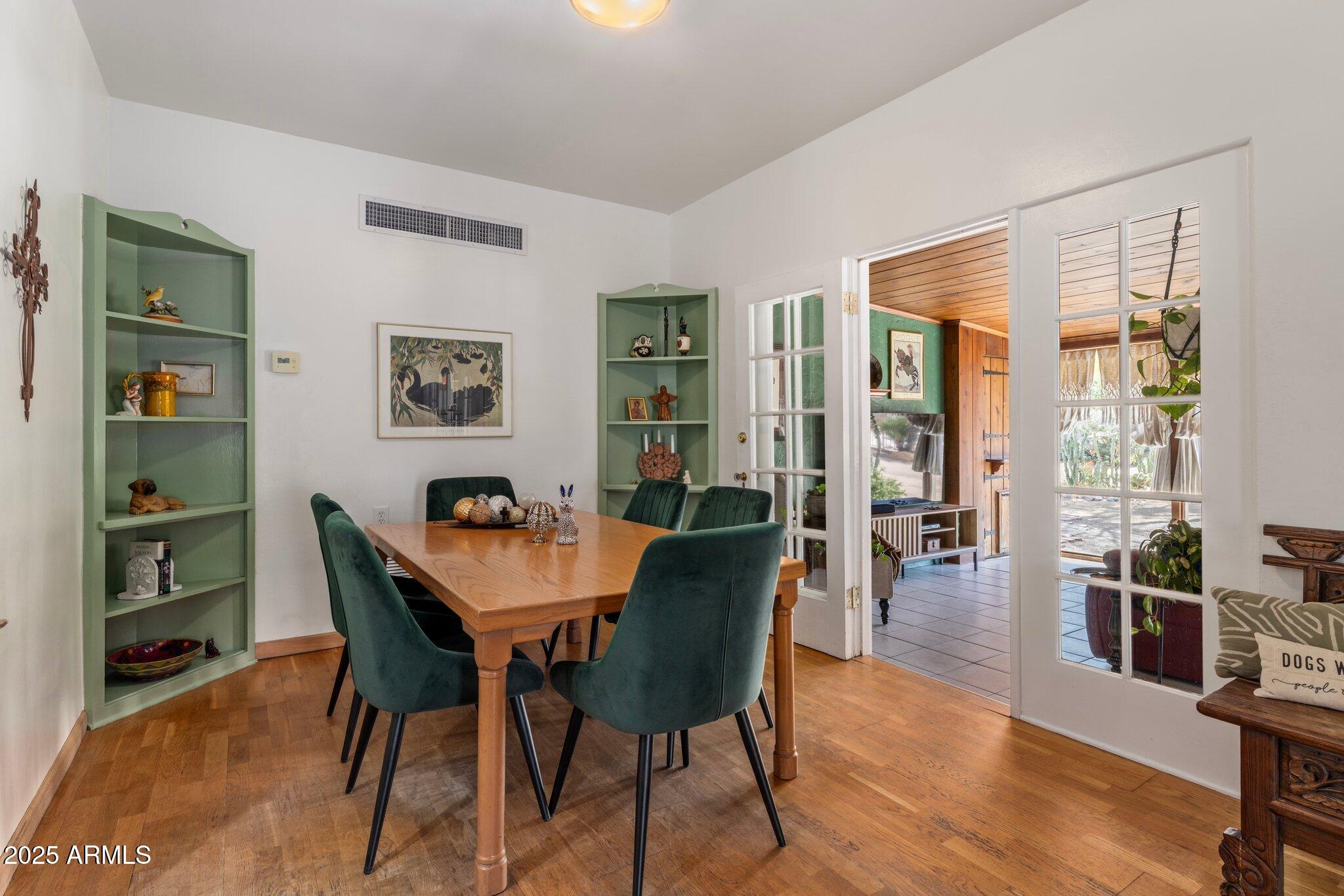 55 East Pierson Street Phoenix, AZ 85012 - Photo 5 of 26 a view of a dining room with furniture and wooden floor