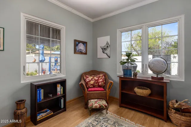 a room with painting and a table