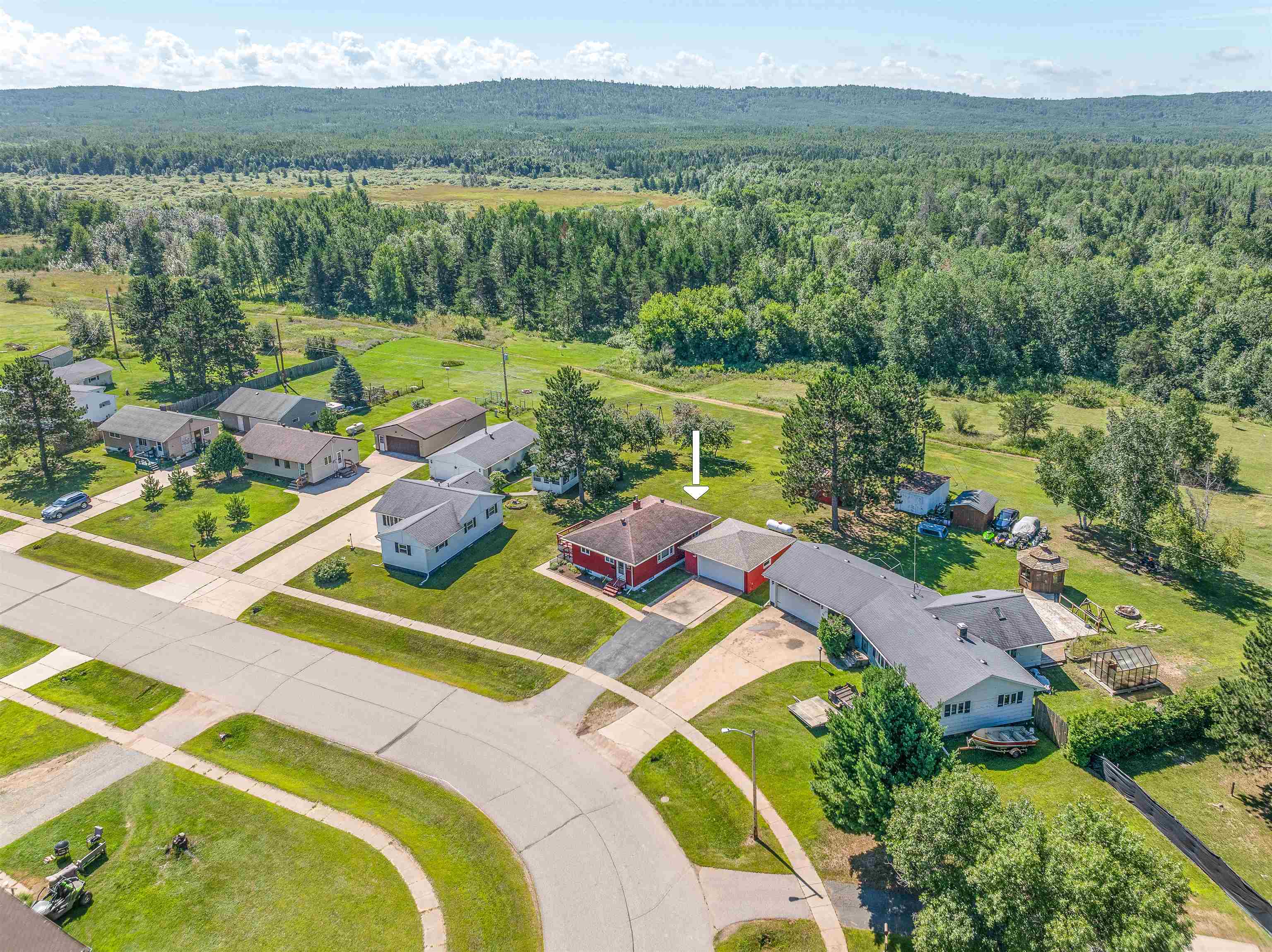 30 Fir Circle Babbitt, MN 55706 - Photo 6 of 27 Aerial view of residential area featuring a forest