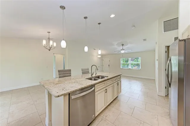 a view of a kitchen with furniture and a window