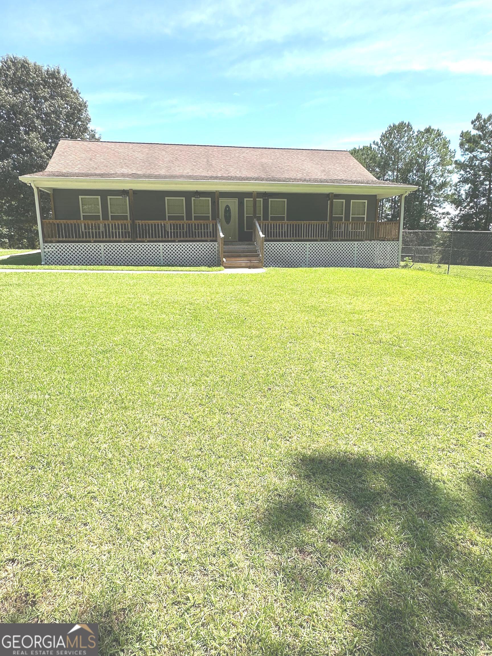 a view of swimming pool with outdoor seating and yard