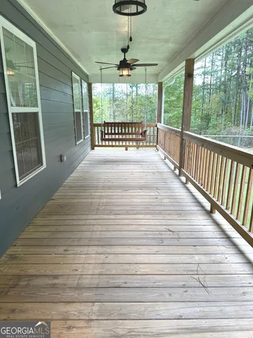 a view of a yard with a wooden fence
