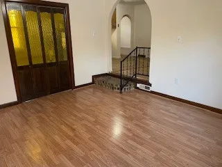 a bedroom with a bed and a mirror