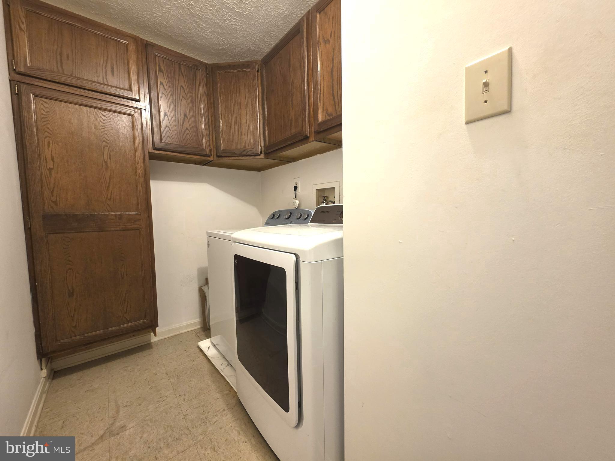 58 Windbrooke Circle, Unit 58 Gaithersburg, MD 20879 - Photo 18 of 28 a utility room with dryer and washer