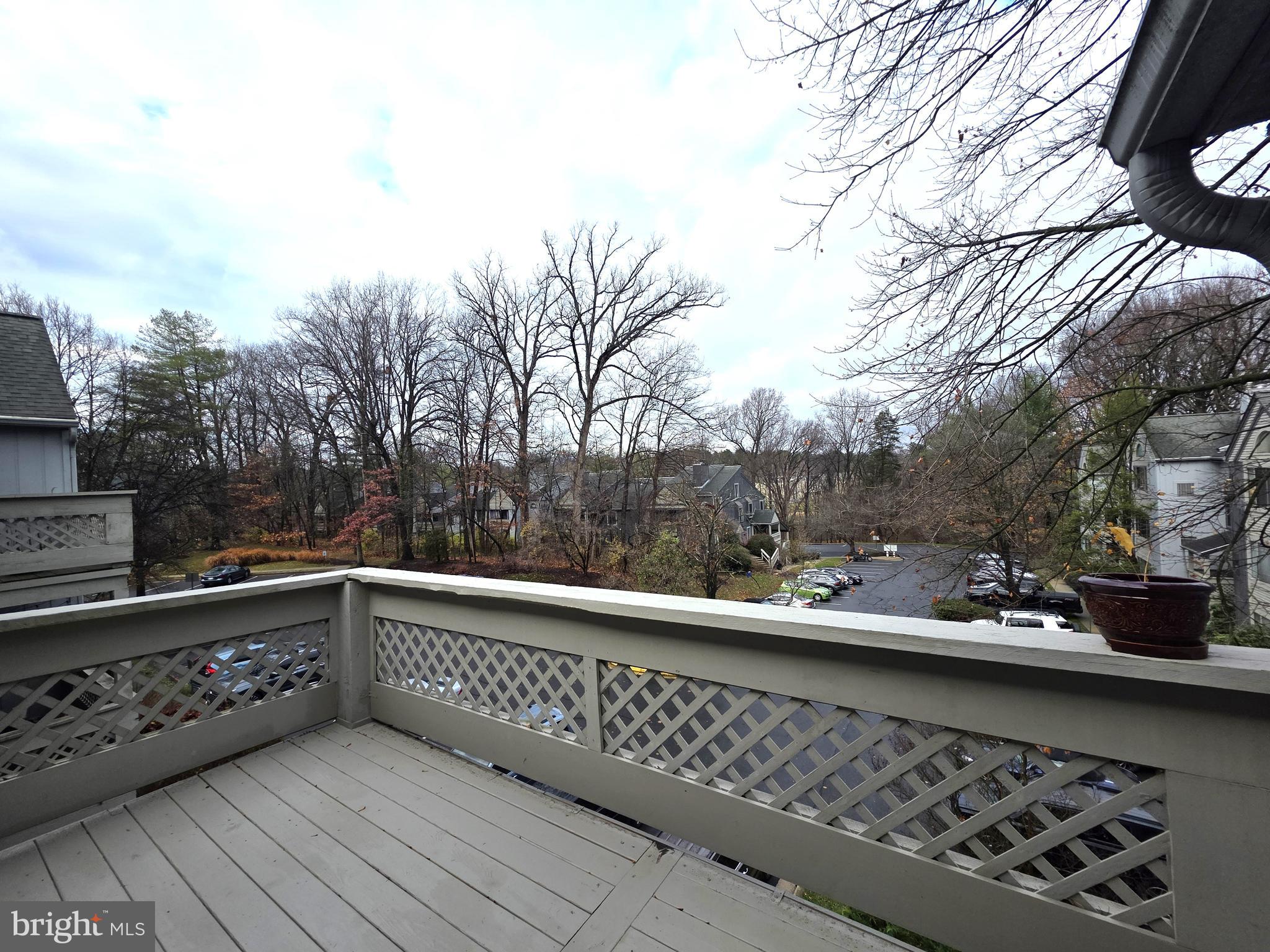58 Windbrooke Circle, Unit 58 Gaithersburg, MD 20879 - Photo 21 of 28 a view of a balcony with wooden fence