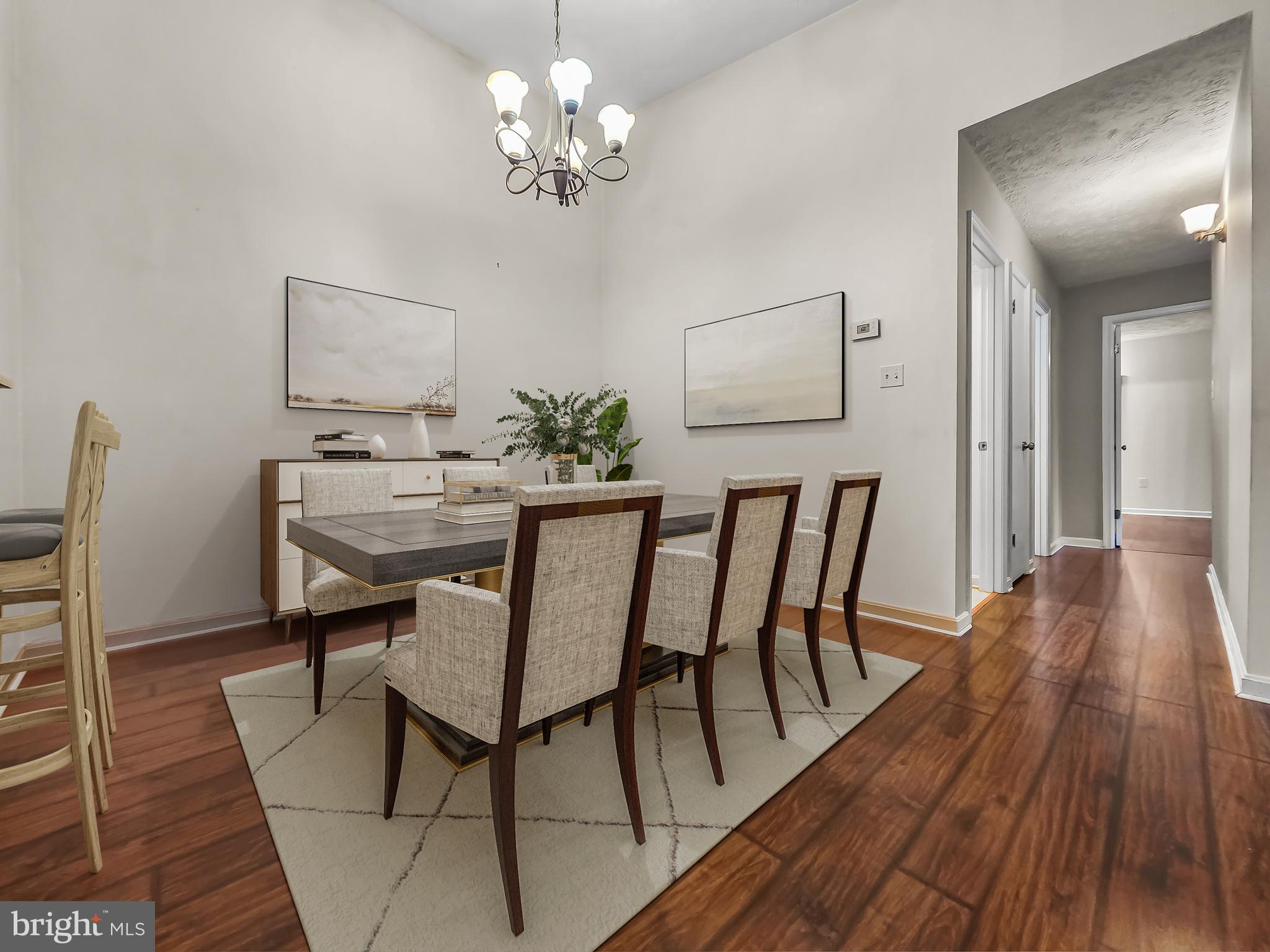 58 Windbrooke Circle, Unit 58 Gaithersburg, MD 20879 - Photo 6 of 28 a view of a dining room with furniture and wooden floor