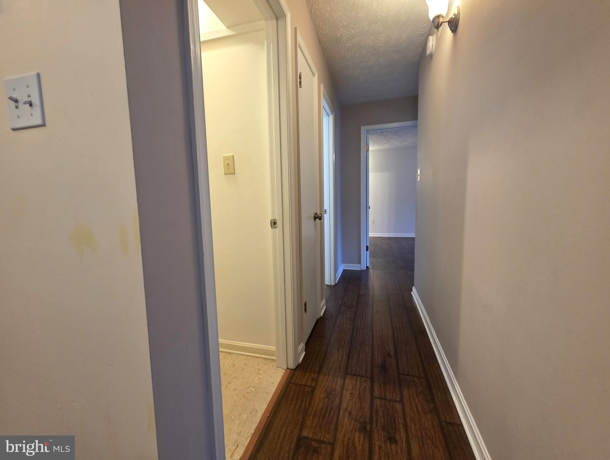 58 Windbrooke Circle, Unit 58 Gaithersburg, MD 20879 - Photo 10 of 28 a view of a hallway with wooden floor