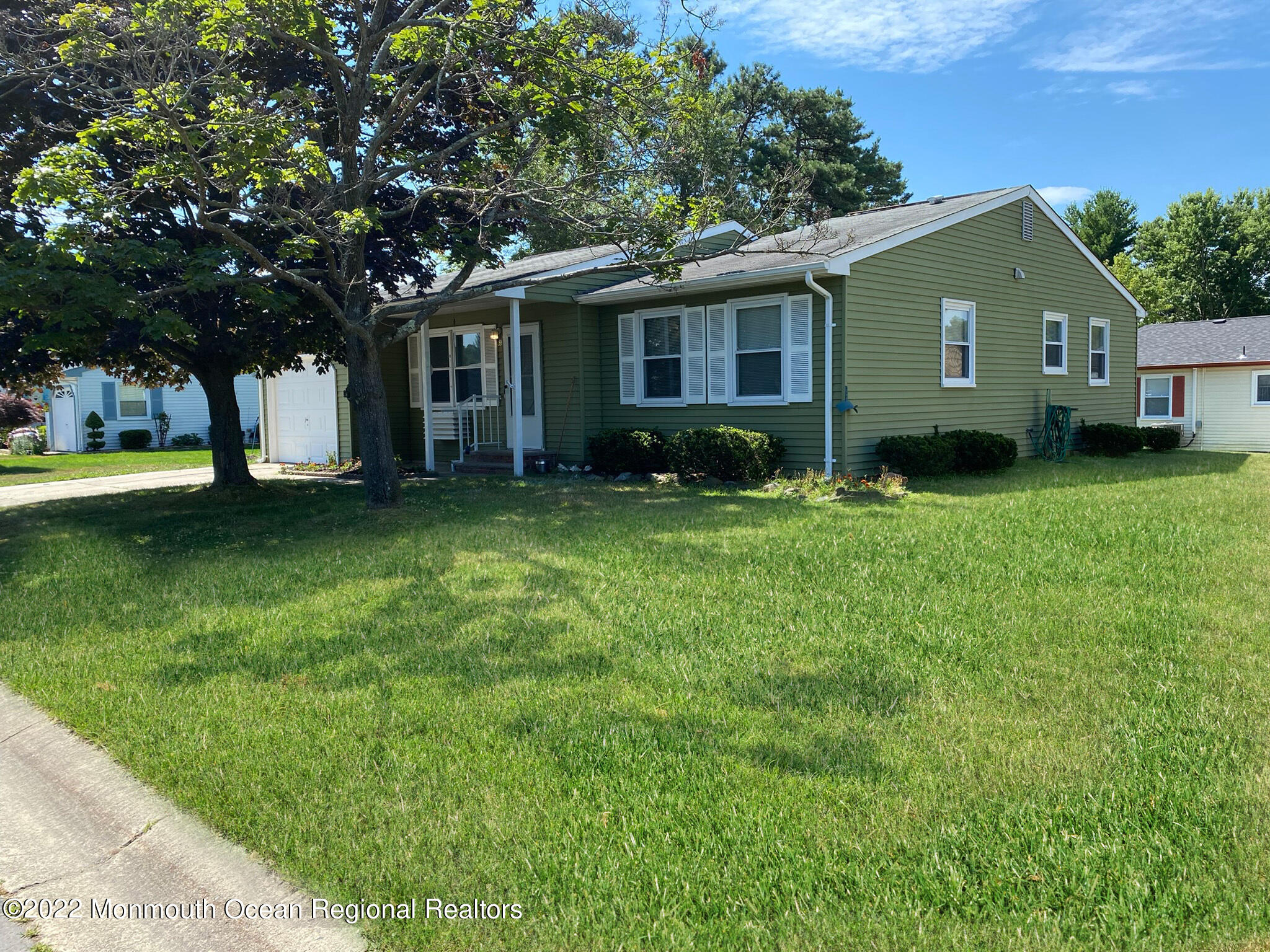 55 Hartford Road, Unit 73 Whiting, NJ 08759 - Photo 3 of 29 50 Hartford Temp Front Angle Grass