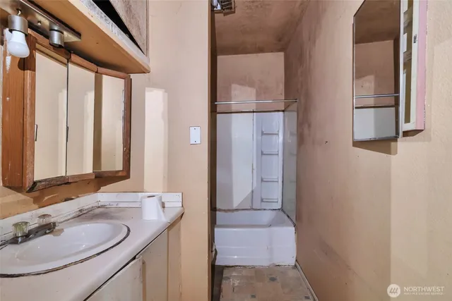 a bathroom with a sink and a mirror