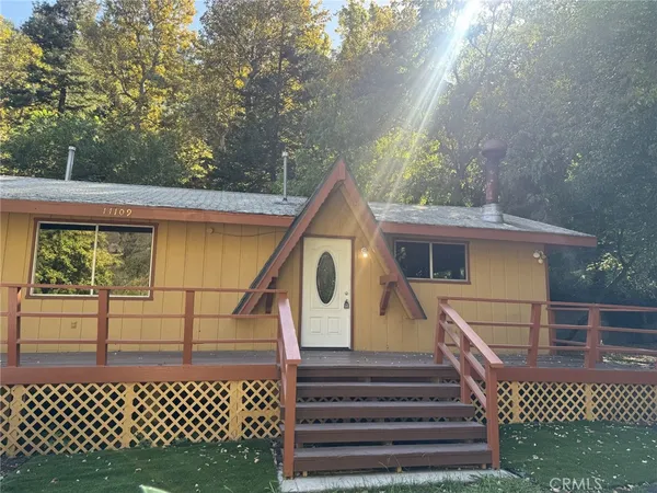 a view of a house with a iron gate