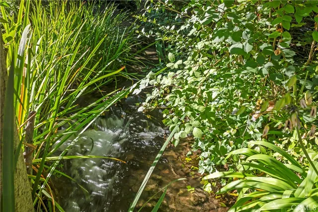 a view of a fountain in front of house