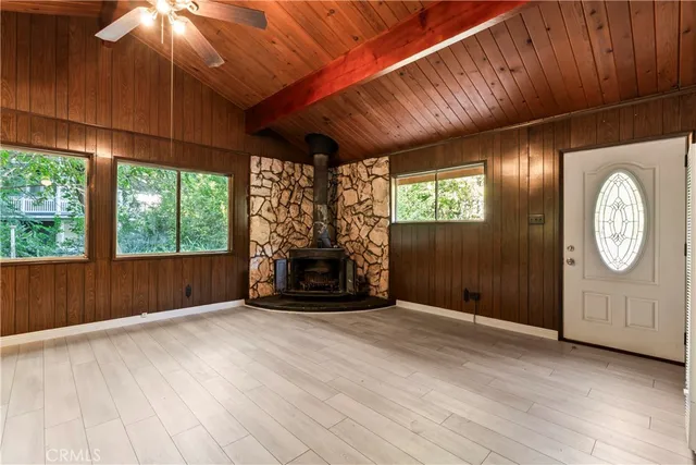 an empty room with windows dryer and way to ceiling window