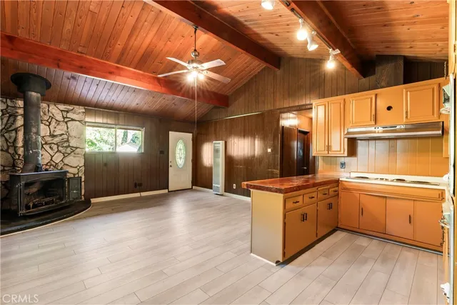 a kitchen with stainless steel appliances granite countertop a stove and a refrigerator