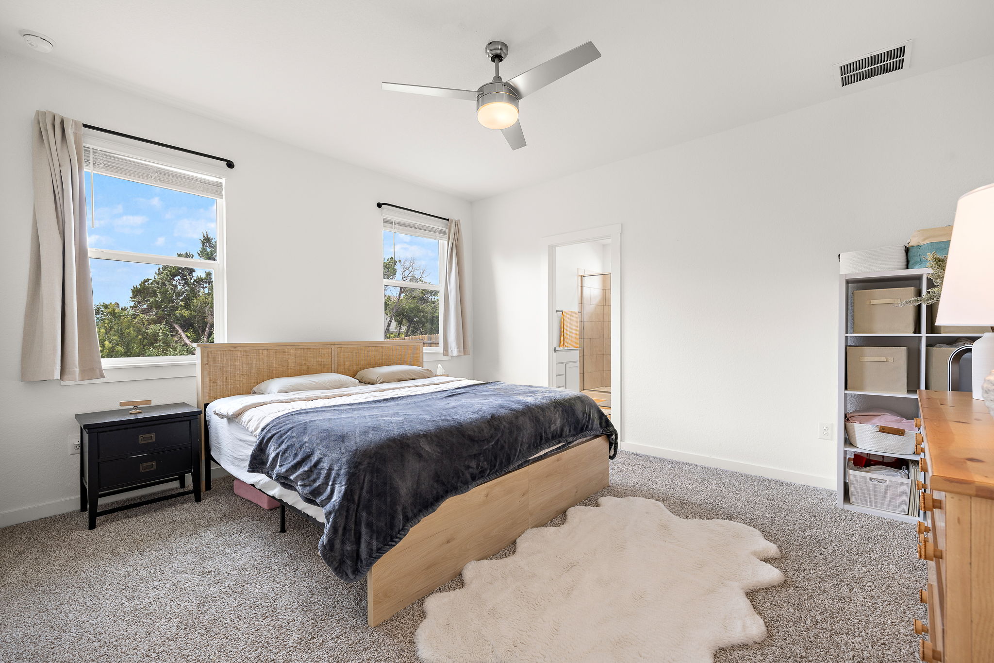2313 Ranier Court Austin, TX 78754 - Photo 11 of 22 a bedroom with a bed and a window