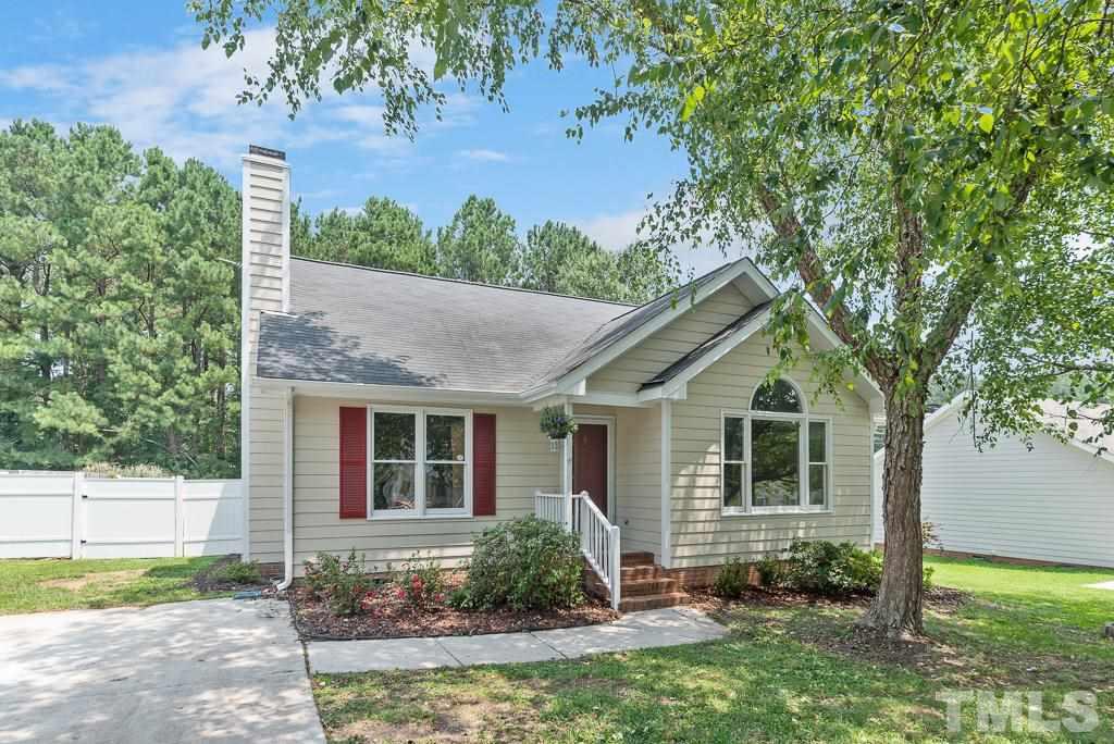 3308 Castlegate Drive Raleigh, NC 27616 - Photo 1 of 22 a front view of a house with garden