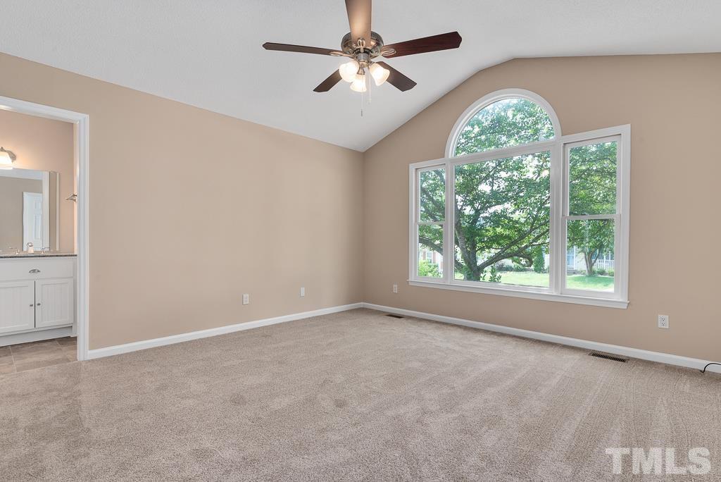 3308 Castlegate Drive Raleigh, NC 27616 - Photo 11 of 22 an empty room with windows and ceiling fan
