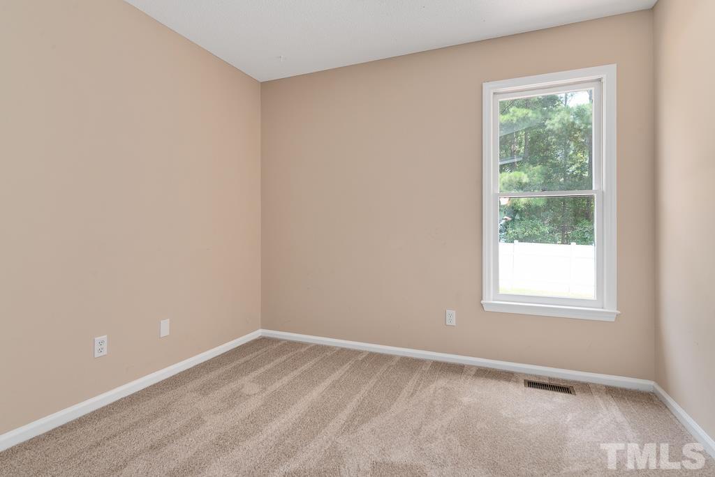 3308 Castlegate Drive Raleigh, NC 27616 - Photo 15 of 22 an empty room with a window