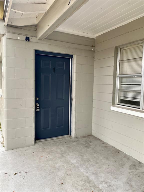 38313 Tucker Road Zephyrhills, FL 33542 - Photo 2 of 46 an empty room with windows