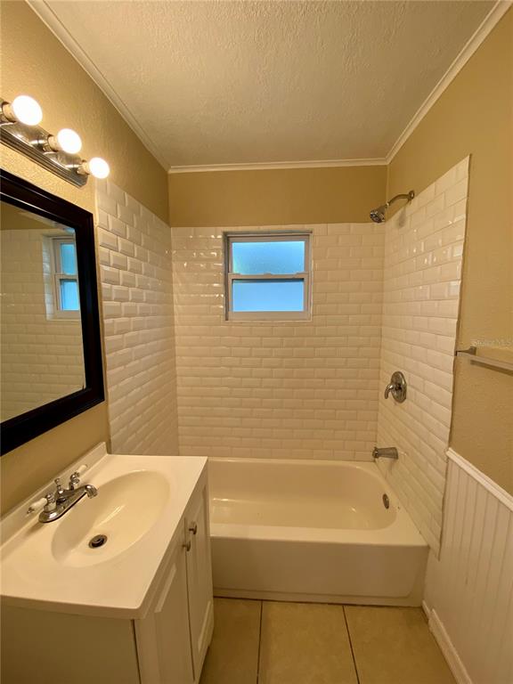 38313 Tucker Road Zephyrhills, FL 33542 - Photo 21 of 46 a bathroom with a sink and a bathtub