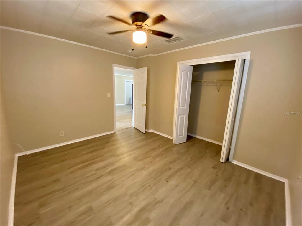 38313 Tucker Road Zephyrhills, FL 33542 - Photo 23 of 46 wooden floor in an empty room