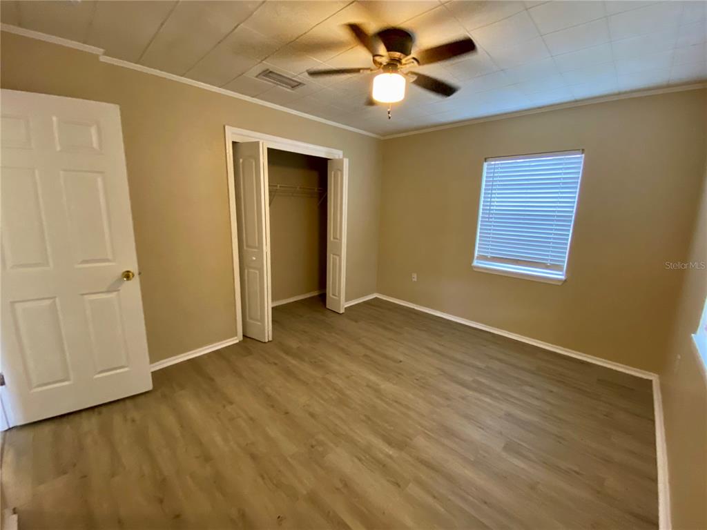38313 Tucker Road Zephyrhills, FL 33542 - Photo 24 of 46 a view of an empty room with a window