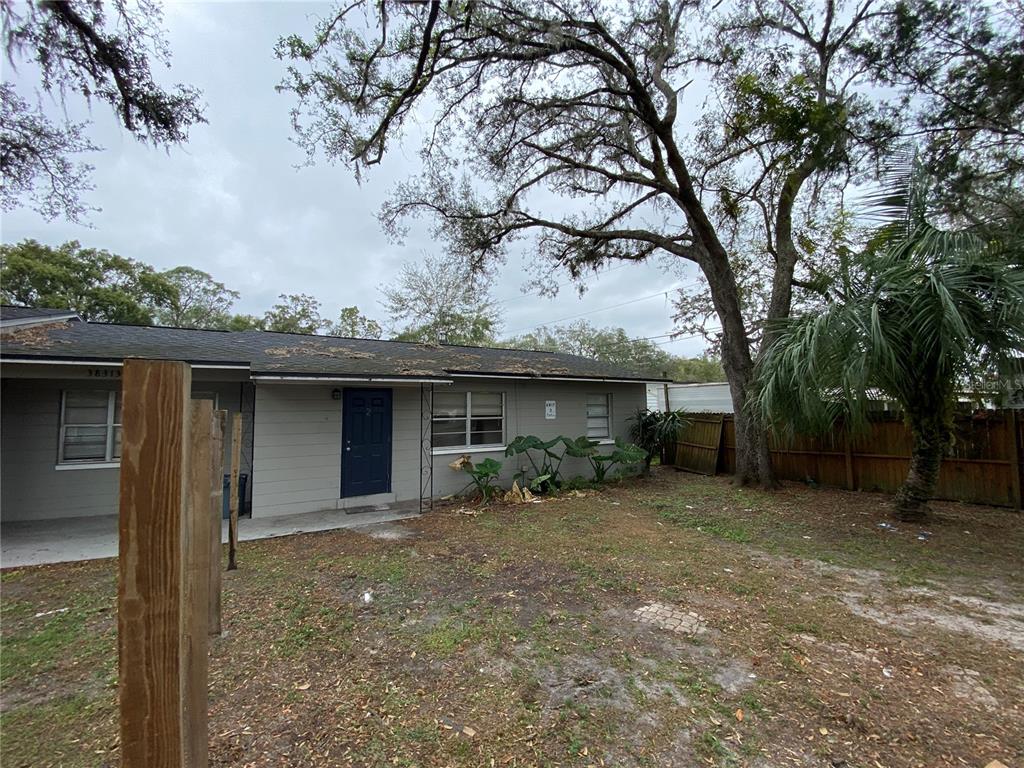 38313 Tucker Road Zephyrhills, FL 33542 - Photo 25 of 46 a view of a house with a yard and tree