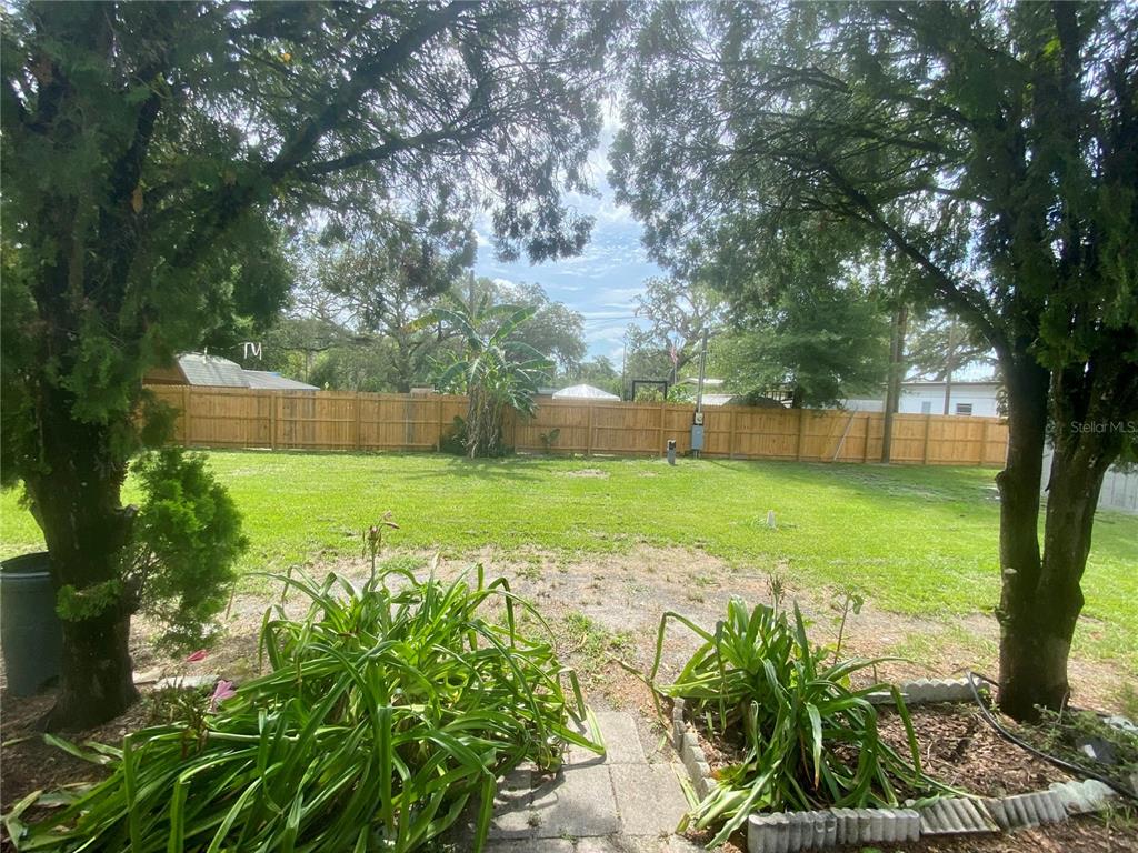 38313 Tucker Road Zephyrhills, FL 33542 - Photo 43 of 46 a view of a garden with an outdoor space