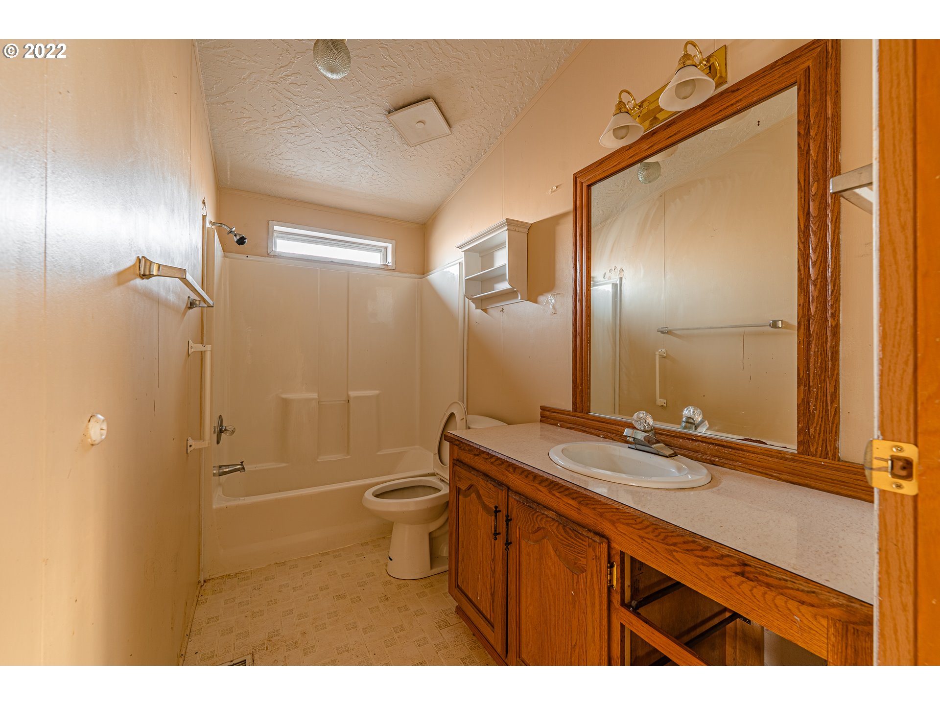 1699 North Terry Street, Unit SP149 Eugene, OR 97402 - Photo 17 of 25 a bathroom with a sink mirror toilet shower and vanity