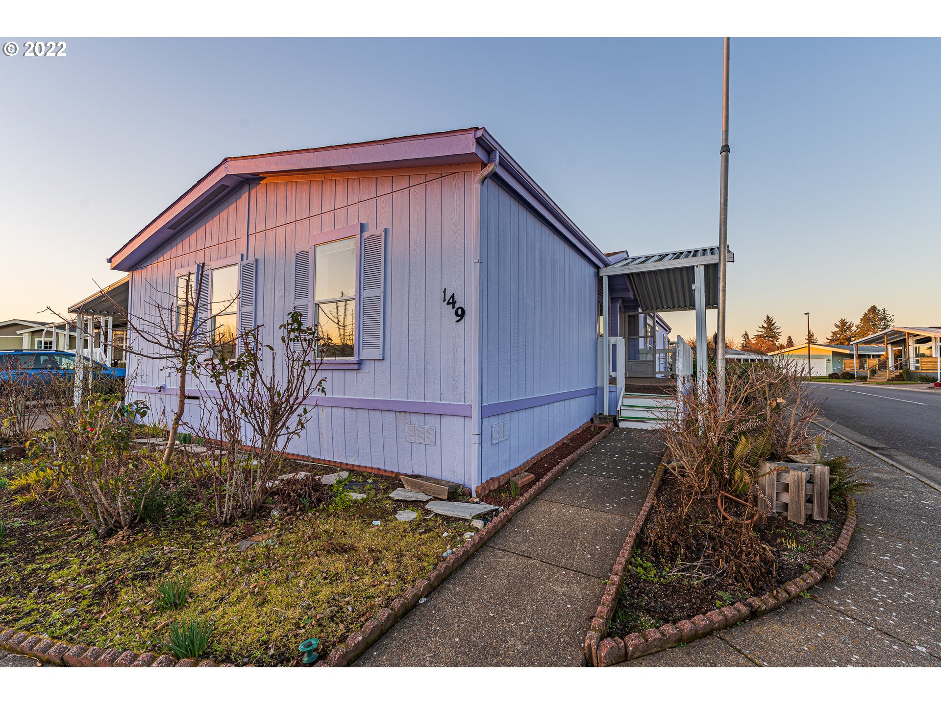 1699 North Terry Street, Unit SP149 Eugene, OR 97402 - Photo 21 of 25 a backyard of a house with barbeque oven