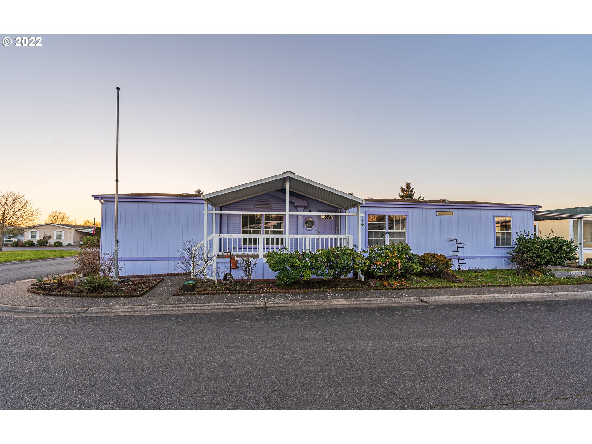 1699 North Terry Street, Unit SP149 Eugene, OR 97402 - Photo 25 of 25 a front view of a house with a yard and parking