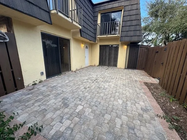 a view of a house with wooden wall and roof