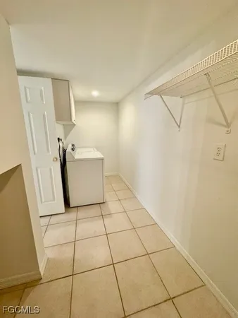 a view of a livingroom with wooden floor and white walls