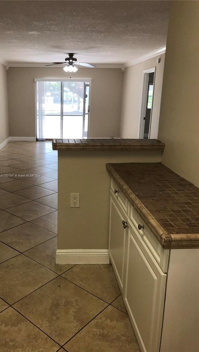 Davie Davie, FL 33314 - Photo 1 of 6 a view of a kitchen with a sink and a window