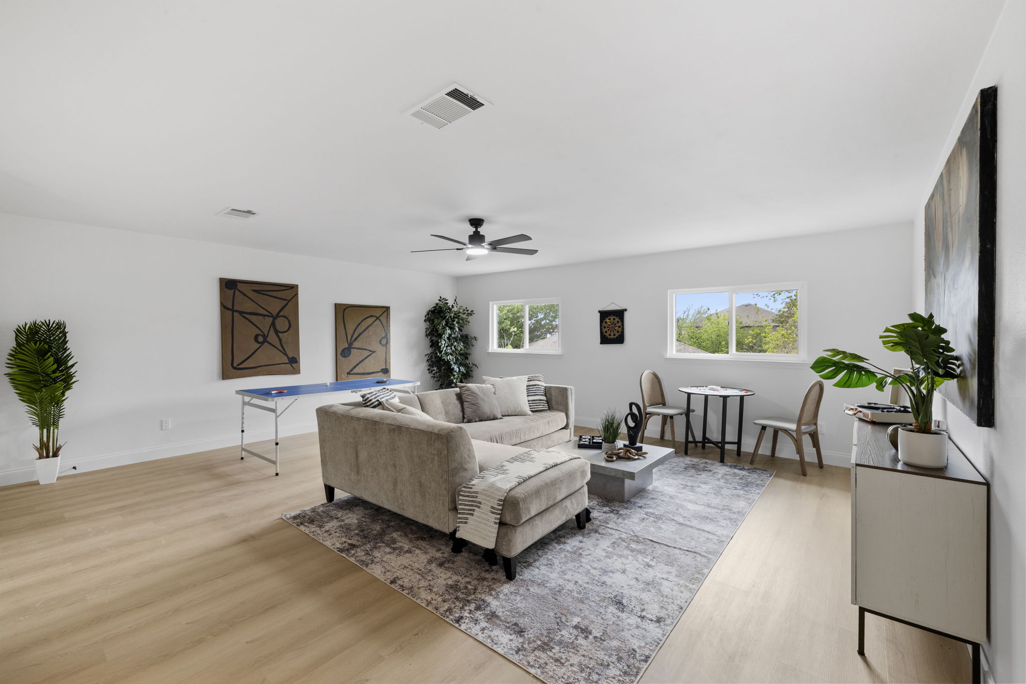 3722 Blue Cat Way Round Rock, TX 78665 - Photo 20 of 40 a living room with furniture and a wooden floor
