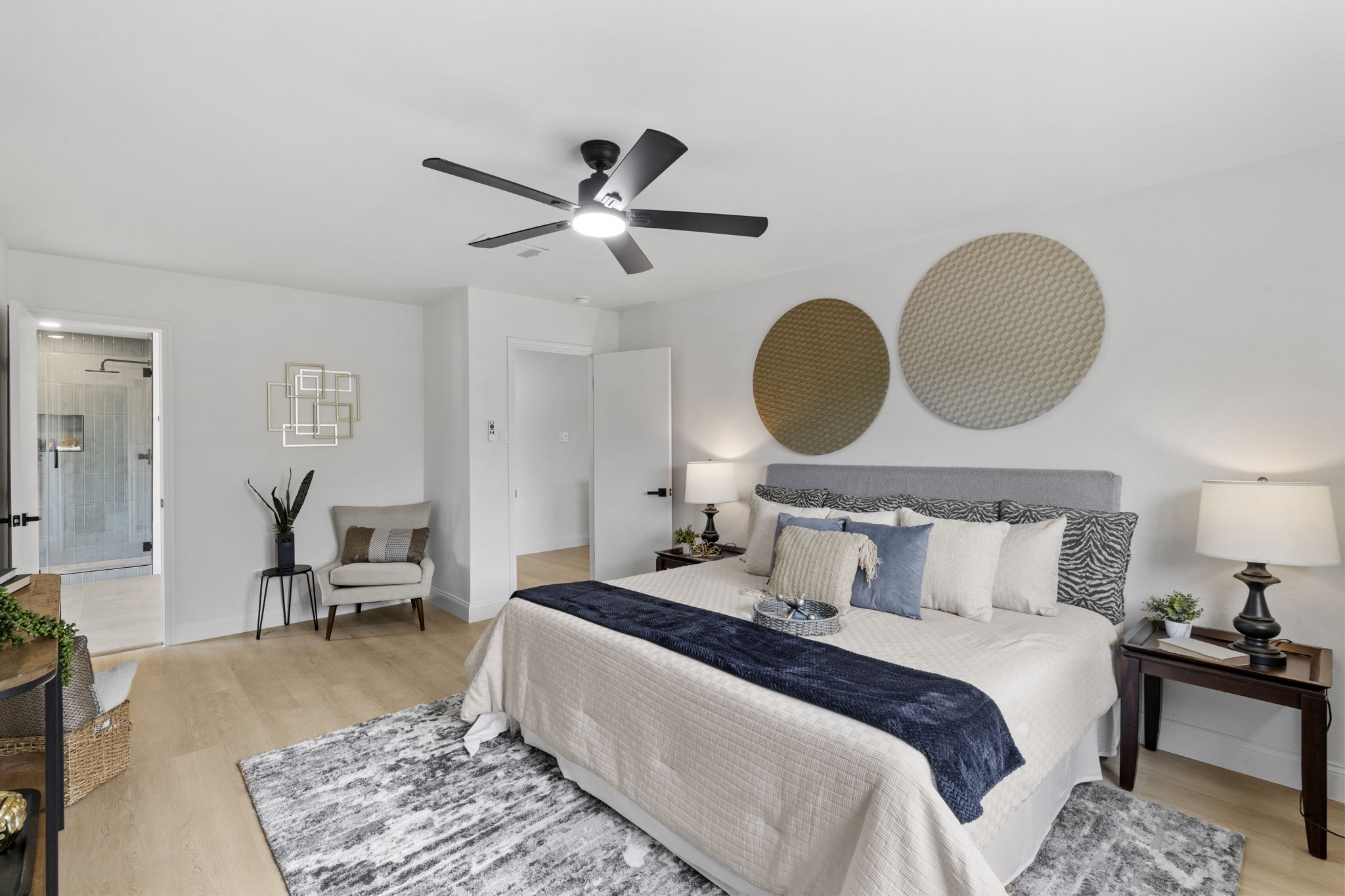 3722 Blue Cat Way Round Rock, TX 78665 - Photo 22 of 40 a bedroom with a bed and a chandelier
