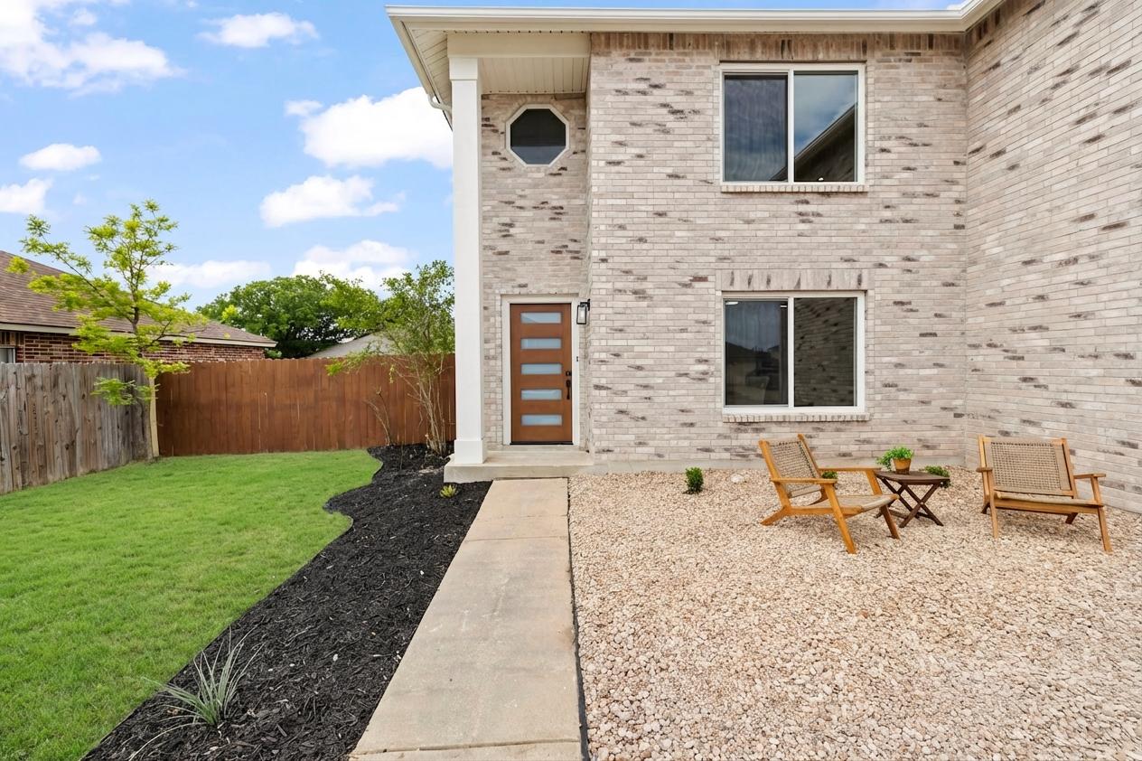 3722 Blue Cat Way Round Rock, TX 78665 - Photo 3 of 40 a backyard of a house with seating space