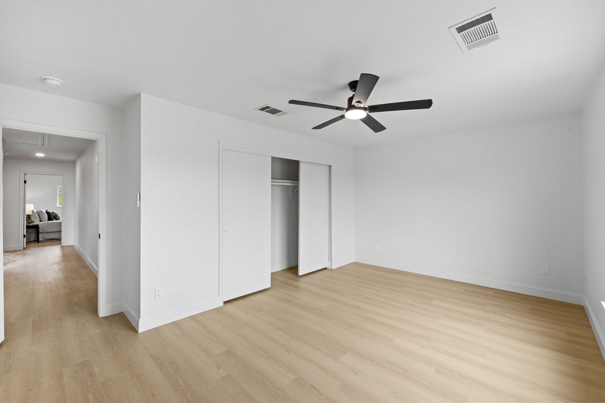 3722 Blue Cat Way Round Rock, TX 78665 - Photo 36 of 40 a view of a big room with wooden floor and a ceiling fan