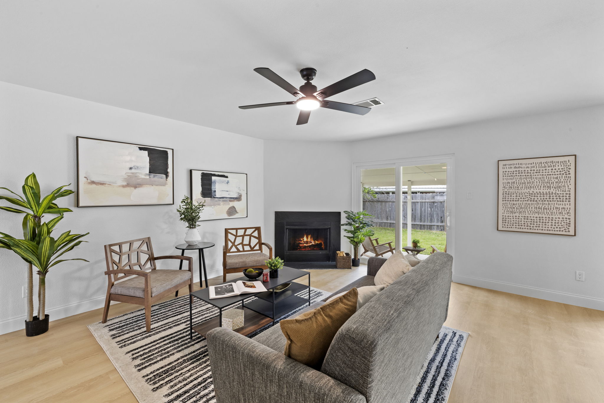 3722 Blue Cat Way Round Rock, TX 78665 - Photo 7 of 40 a living room with furniture a window and a fireplace