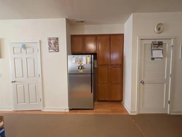 a view of a dining room with furniture and window
