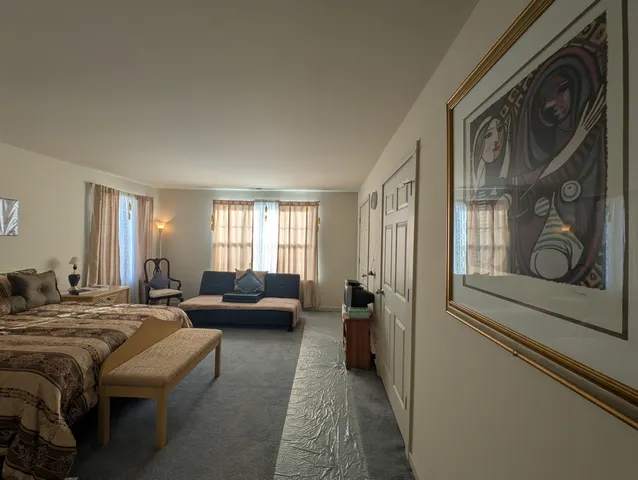 a bedroom with a bed and furniture